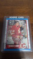 Front of Theo Fleury rookie card showing player image and team information