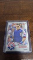 Front view of Tom Brady baseball card in Montreal Expos uniform as catcher.