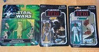 Photo showing three Star Wars action figures in original packaging: Amanaman with Salacious Crumb, Woooof, and Admiral Ackbar