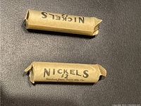 Two wrapped paper rolls labeled 'Nickels $2' and 'Nickels'