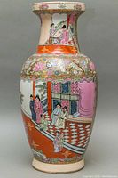 Full view of the vase showing hand-painted traditional Japanese scenes and floral decorations.