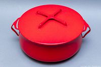 Top and side views of the red enamel covered pot with cross handle lid