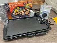 Second similar angle photo focusing on the griddle and showing all items behind it.