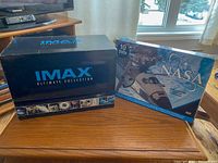 IMAX Ultimate Collection box and NASA DVD set box on table