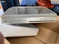 Front view of the Realistic Lab 1500 record player showing power button and control panel with speed options.