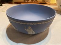 Top side view of the 8-inch round Wedgwood blue jasperware bowl with white relief Greek cameos around the edge and garland pattern near rim.
