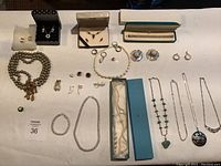 Full overview of all jewelry pieces laid out on table