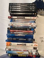 Photo of the full stack of DVDs showing various titles such as Star Wars trilogies, Chappelle's Show seasons, Skyfall, Casino.