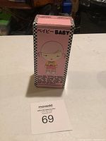 Front view of the pink box with cartoon girl and Baby text.