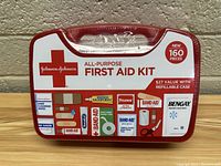 Front view of sealed Johnson & Johnson All-Purpose First Aid Kit showing packaging and included items images