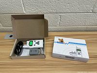 Remote Pet Training Collar by Vinsic in original packaging, showing remote control and receiver collar devices alongside box.