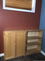 Maple cabinet and bookcase side by side against a wall, showing overall appearance and proportions.