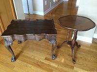 Two tables side by side on hardwood floor, front view
