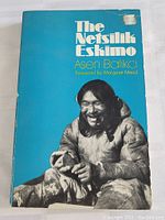 Cover of 'The Netsilik Eskimo' book showing an Inuit man and author title.