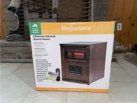 Front view of original packaging showing heater image, brand Life Source, and features.