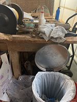 Closer view of the work table surface and items to show condition and included tools.