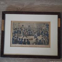 Full view of framed engraving on wooden floor showing the entire artwork and frame.