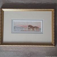 Front view of framed antique watercolour seascape painting showing gold-toned rope-pattern frame and double matting.