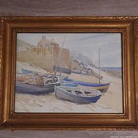 Front view of the framed antique watercolour painting showing a coastal scene with boats at Sennen Cove, Cornwall with detailed carved gold frame.