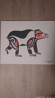 Full front view of the canvas showing the stylized bear design in black and red
