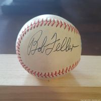 Baseball showing clear Bob Feller autograph on sweet spot