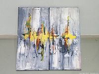 Front view of the diptych showing both panels together with abstract yellow, gray, white, and mixed colors.