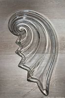 Top-down view of the Mikasa wave shaped platter showing the spiral and jagged edge design.