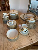 Overall view of china set showing platters, bowls, plates, cups