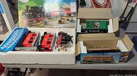 Original Playmobil outer box with interior styrofoam containing locomotive, passenger cars and additional cars.