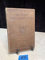 Front cover of the 1916 book 'The Ontario Public School Hygiene', showing title, emblem, and publisher details.