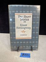 Front cover of the book showing blue dust jacket with repeating 'EH' pattern and title label.