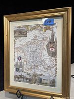 Image shows vintage map of Worcestershire county in decorative gilded wood frame with detailed towns and roads plus ornamental illustrations.