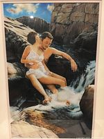 Close-up photo of the framed serigraph showing the couple by the water with visible acrylic oil texture and signature.