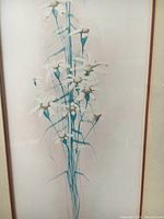 Close-up of the lithograph artwork showing white flowers with blue stems in a vertical arrangement.