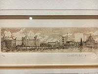 Close-up of etching artwork showing detailed panoramic cityscape and signature with numbering 18/100 and artist's name Ronaldo Norden.