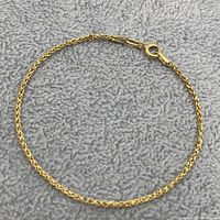 Full view of bracelet laid flat to show overall length and clasp