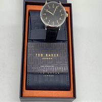 Photo of Ted Baker men's Cosmop watch in original box with leather protective case and user manual.