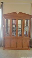 Front view of the full two-piece china cabinet. Shows overall design and size.