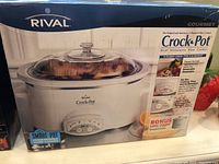 Original box of Rival Crock Pot slow cooker showing product image and features.