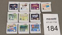 Overhead view of ten Nintendo 3DS cartridges laid out on table