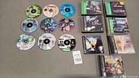 Nine loose PlayStation discs arranged in grid