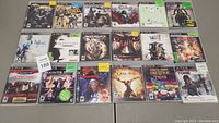 Overall layout of 18 PS3 game cases arranged in grid