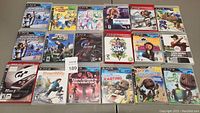 Display of all 18 PS3 game cases in lot, showing front covers and titles