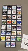 Wide view of all 30 Nintendo DS cartridges arranged in 6x5 grid