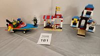 Three Lego SpongeBob SquarePants sets arranged on table showing details and composition.