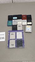 7 used video game memory cards primarily for PlayStation consoles on a gray surface.