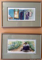 Two framed watercolours shown one above the other on a wall.