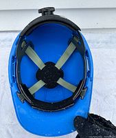 Interior view showing adjustable suspension system with straps and cushioned band.