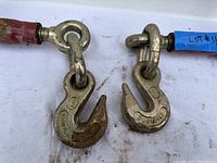Close-up view of the load binder hooks showing the 'DURABILT' stamp and wear on the metal