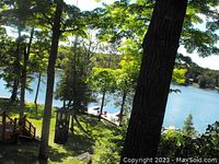 View of lake and wooded shoreline from lodge grounds